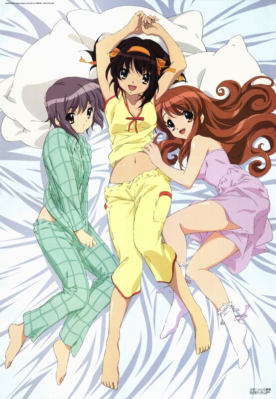 Three girls in pajamas on a bed