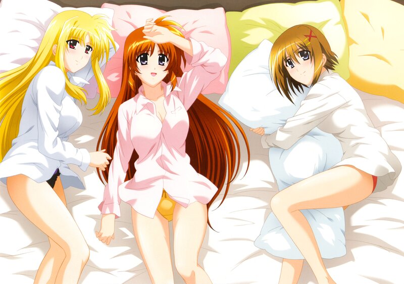 Three girls in pajamas on a bed