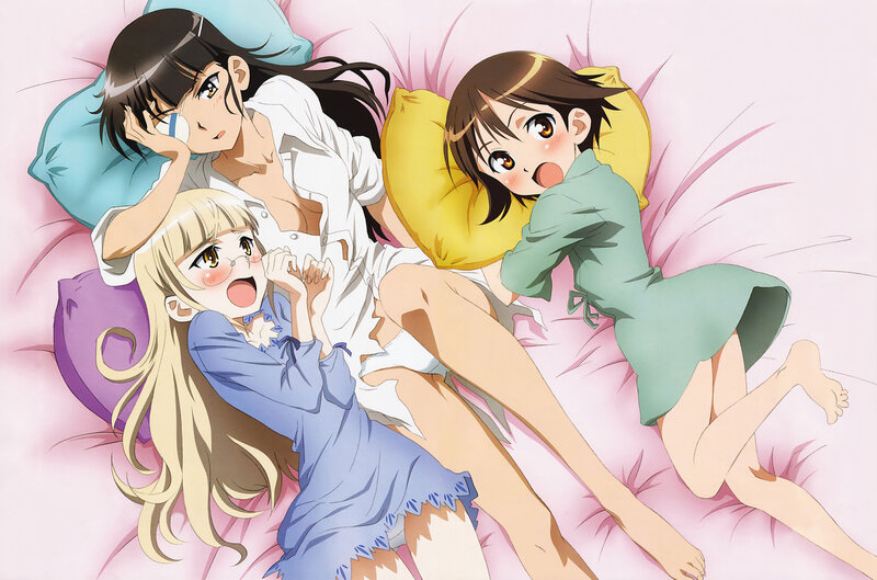Three girls in pajamas on bed