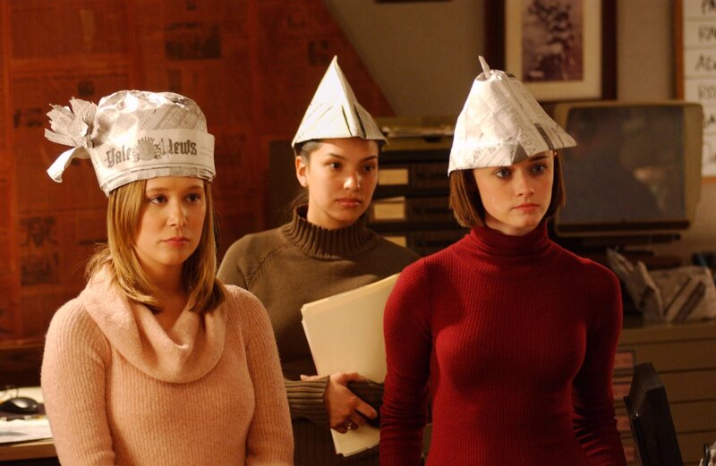 Three girls in paper hats