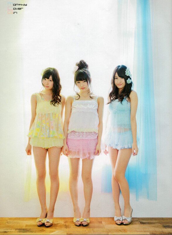 Three girls in pastel dresses
