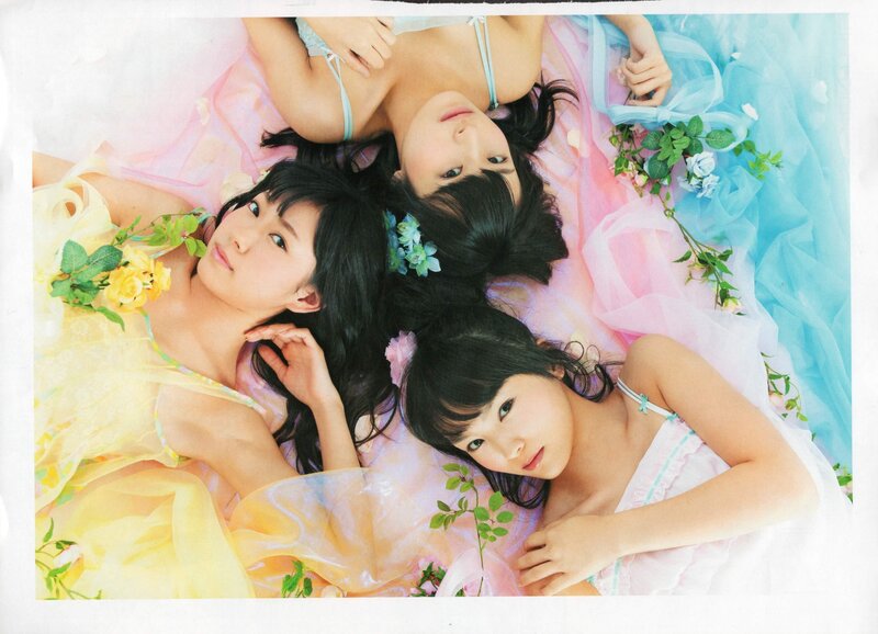 three girls in pastel dresses