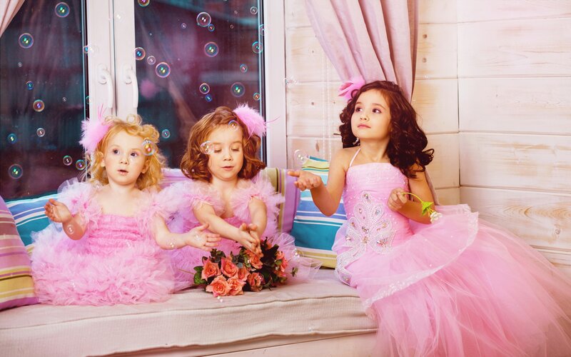 Three Girls in Pink Dresses — Playful