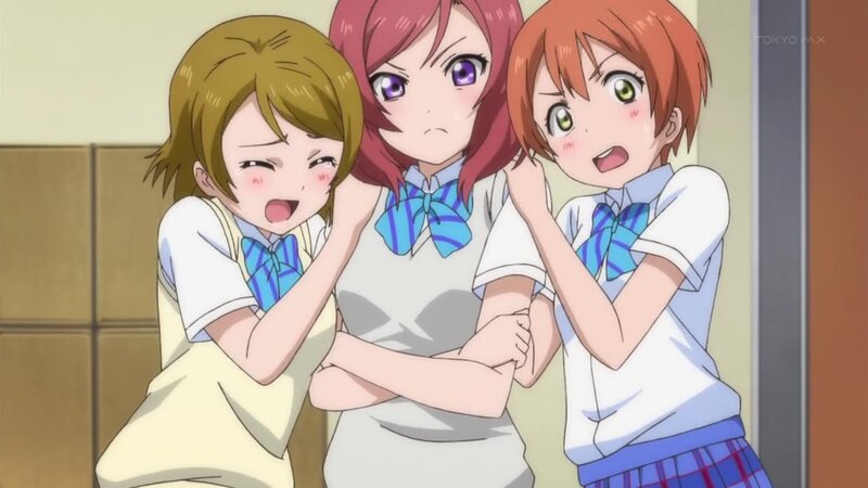 three girls in school uniforms