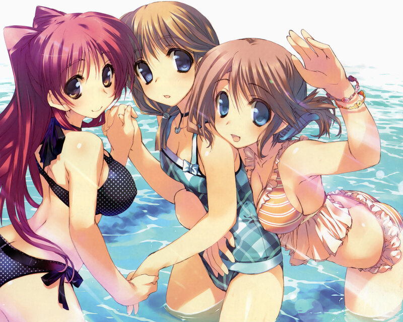 Three girls in swimsuits at the beach