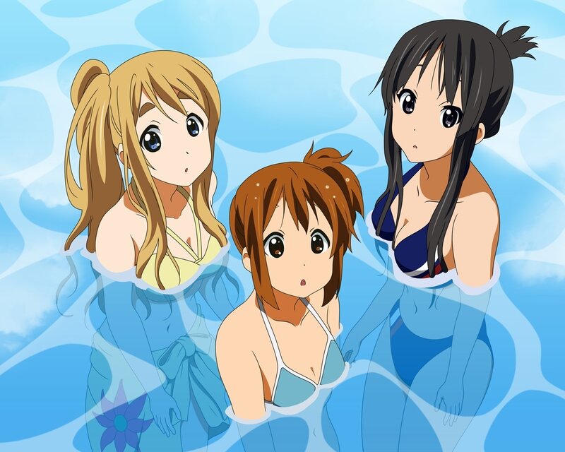 Three girls in swimsuits at the pool
