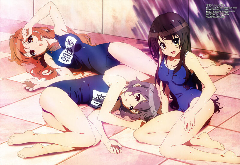 Three girls in swimsuits on floor