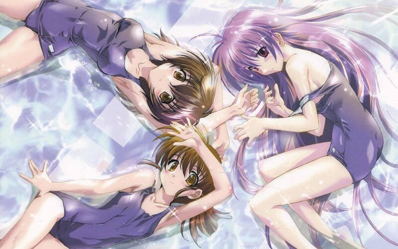 Three girls in swimsuits underwater