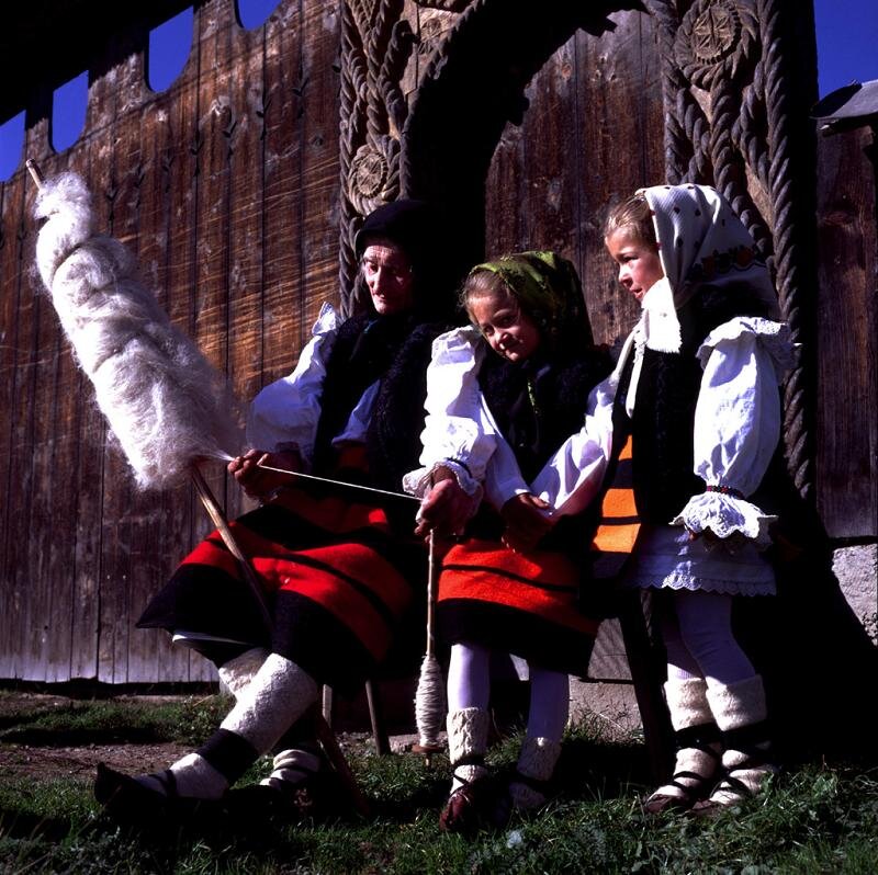 Three Girls in Traditional Clothing — Brown
