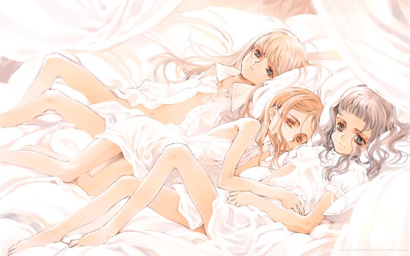Three girls in white bed
