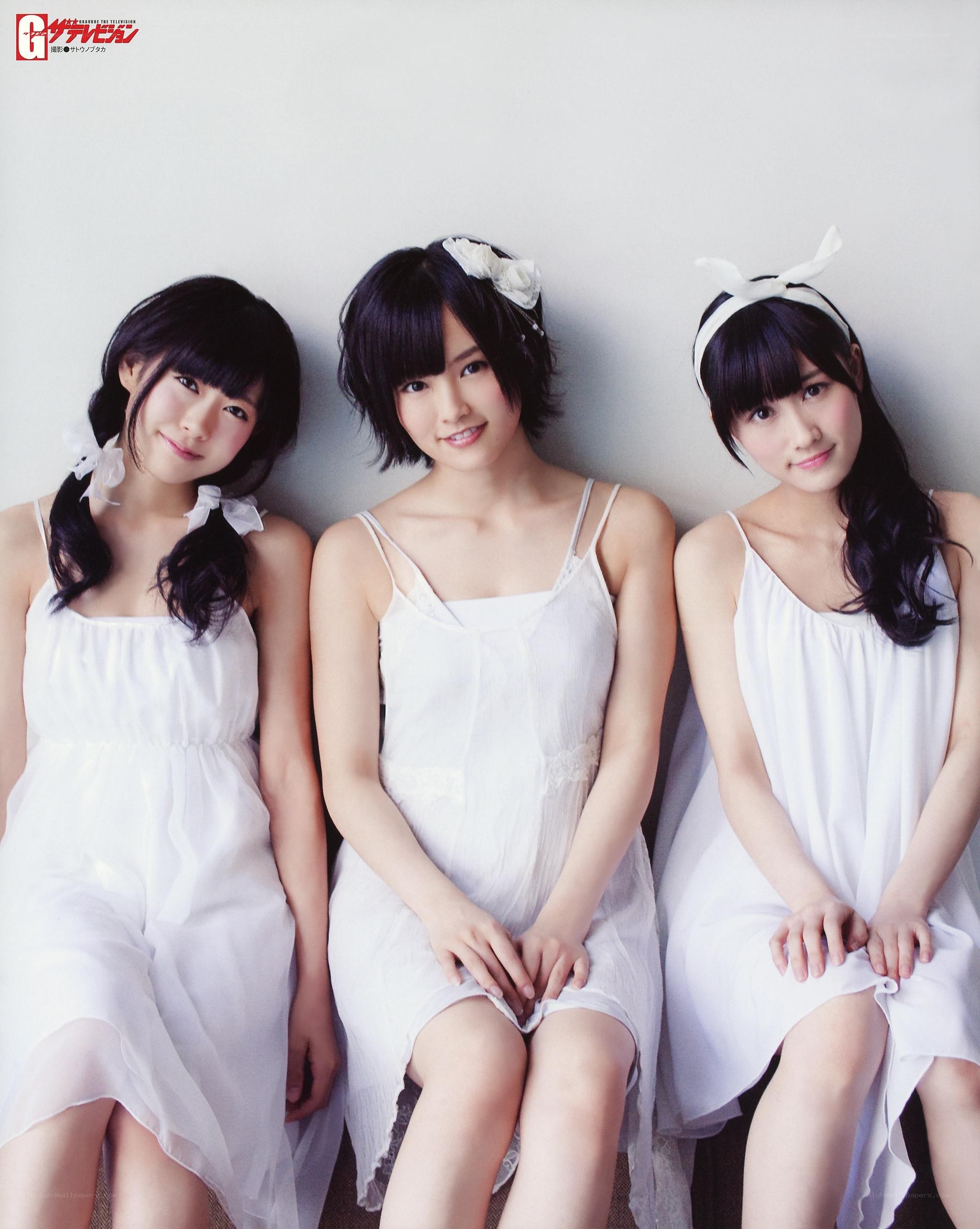 Three girls in white dresses