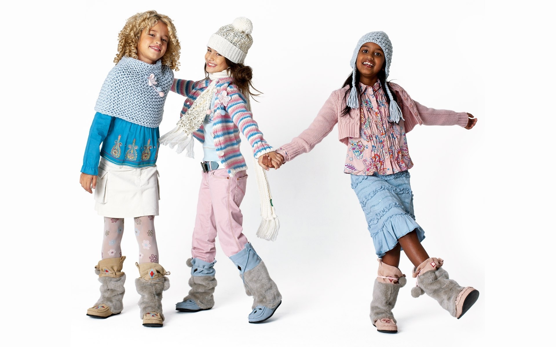 three girls in winter clothes
