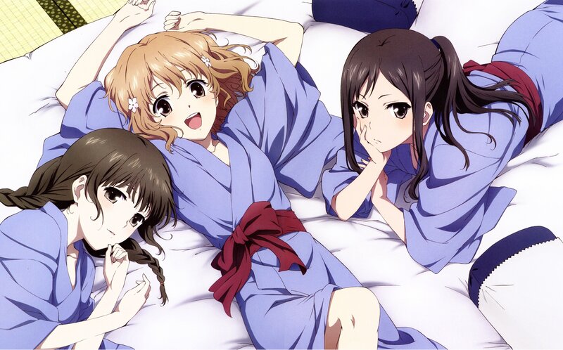 Three girls in yukata on a bed