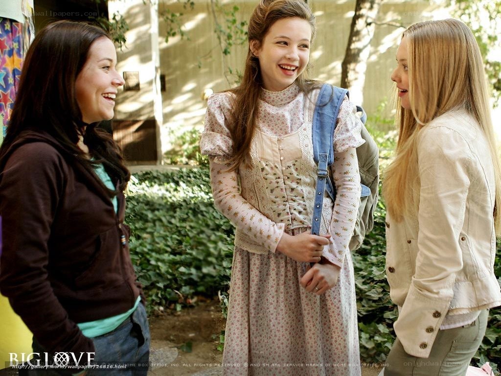 Three girls laughing together