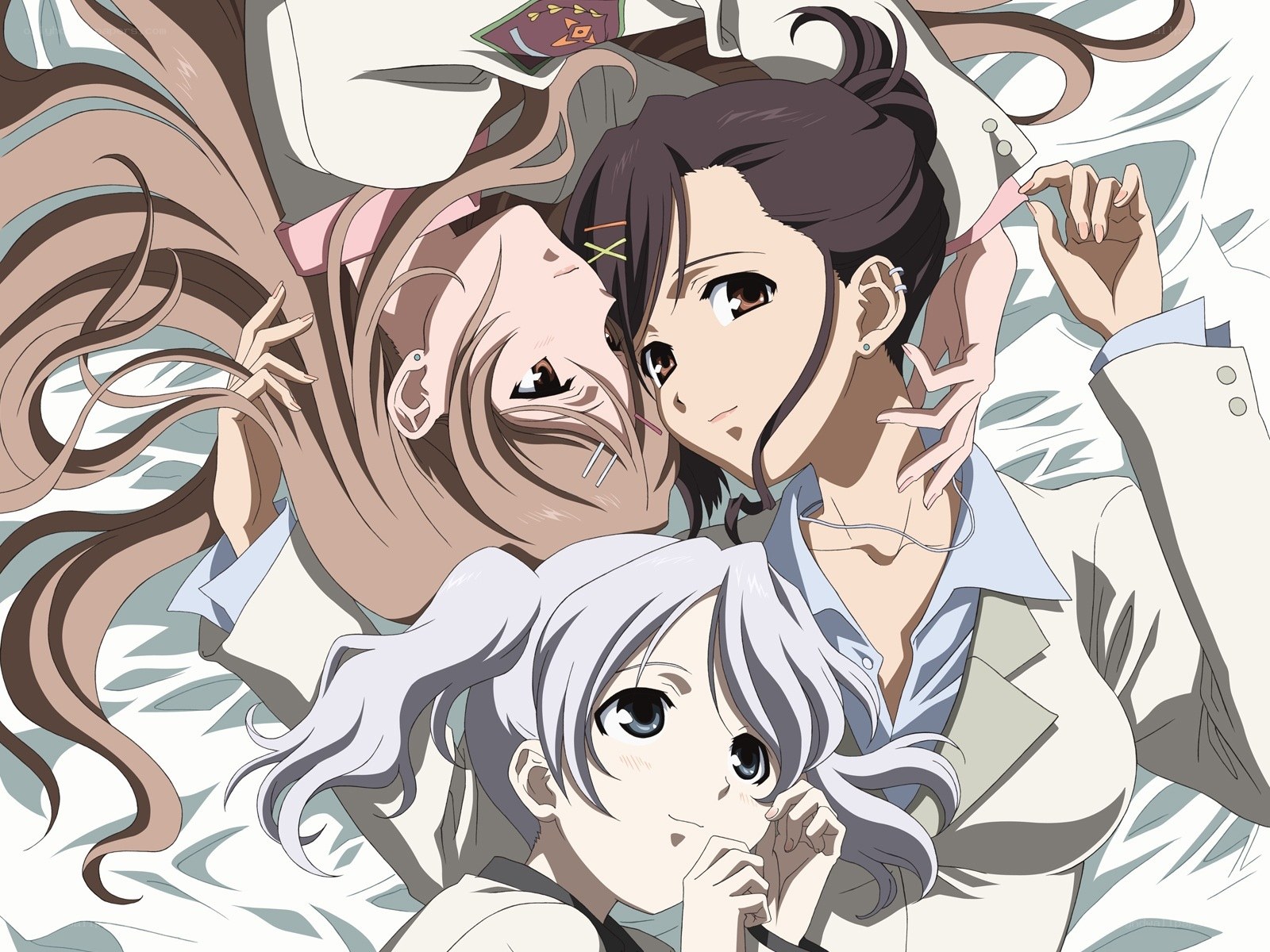 Three girls lying together