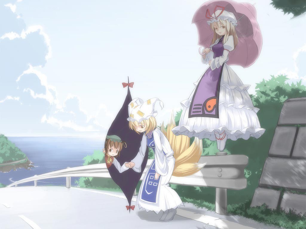 Three girls on a coastal road