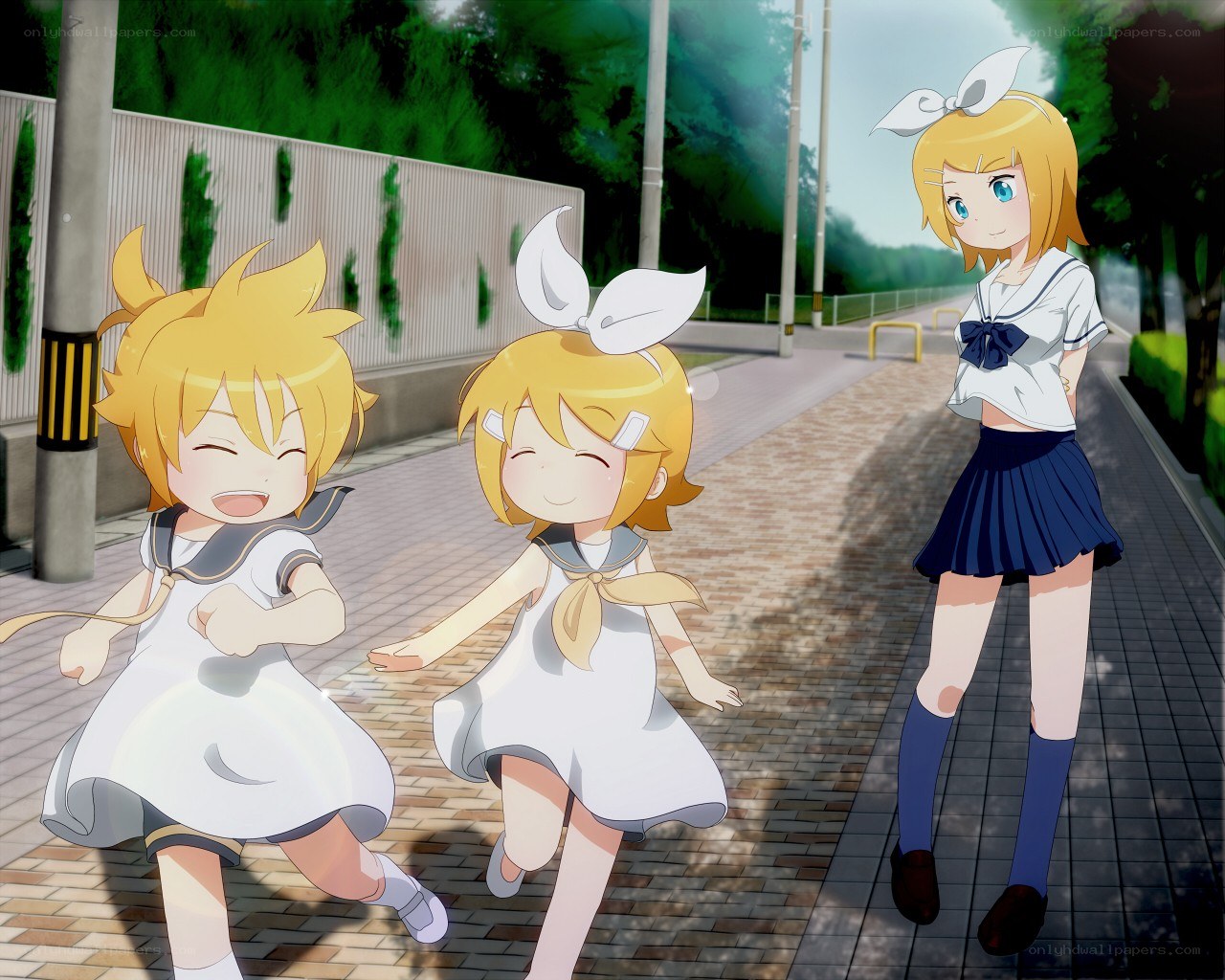 Three girls on a sidewalk