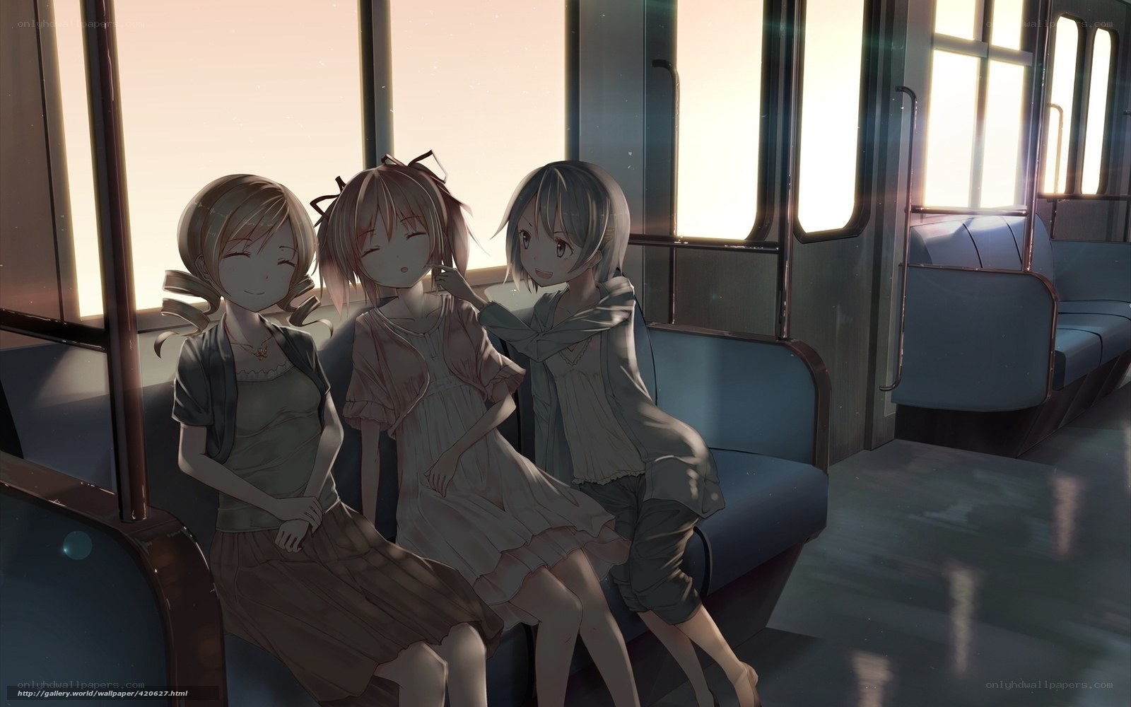 Three girls on a train at sunset