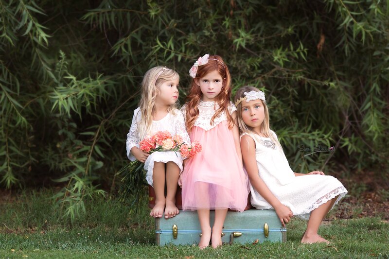 Three Girls on Suitcase
