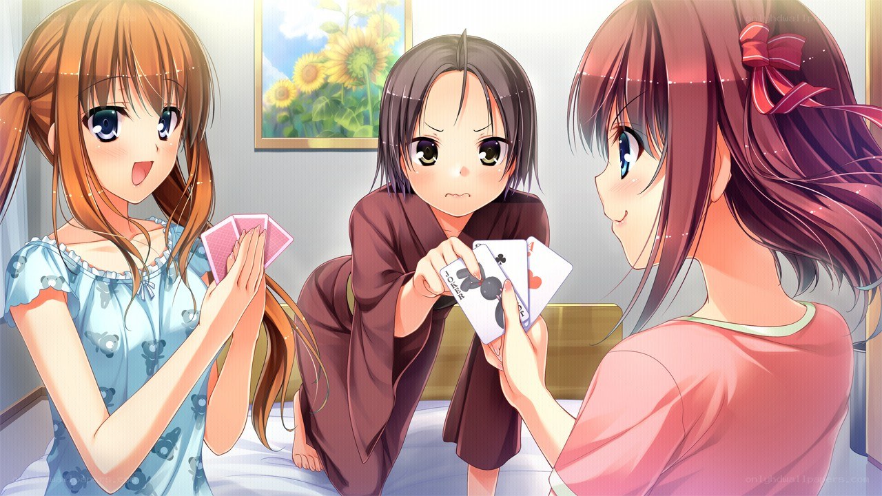 Three girls playing cards