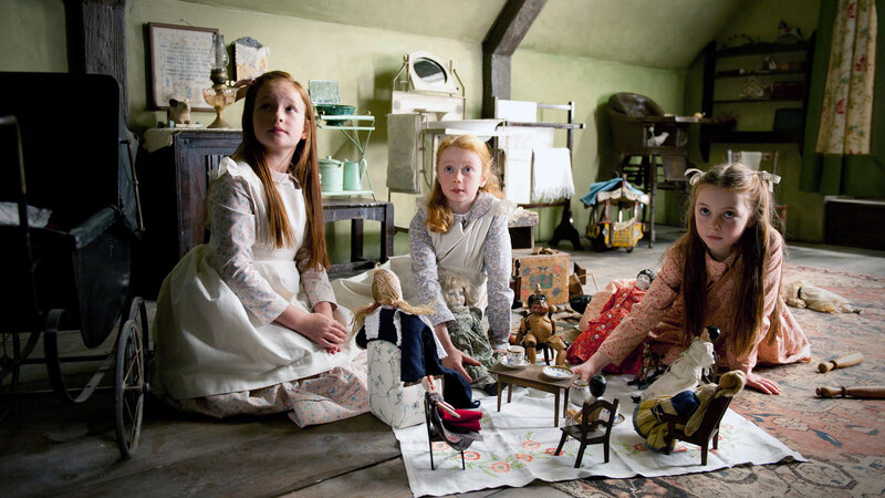 Three Girls Playing with Dolls