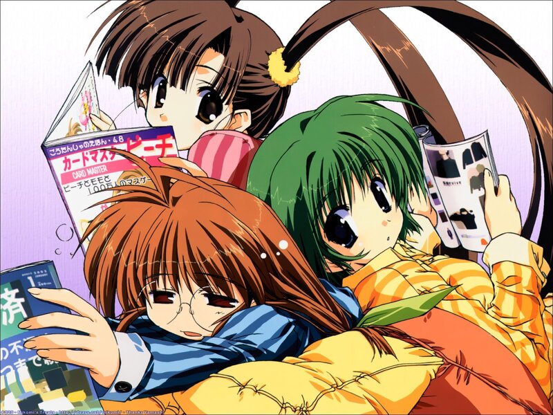 Three girls reading magazines