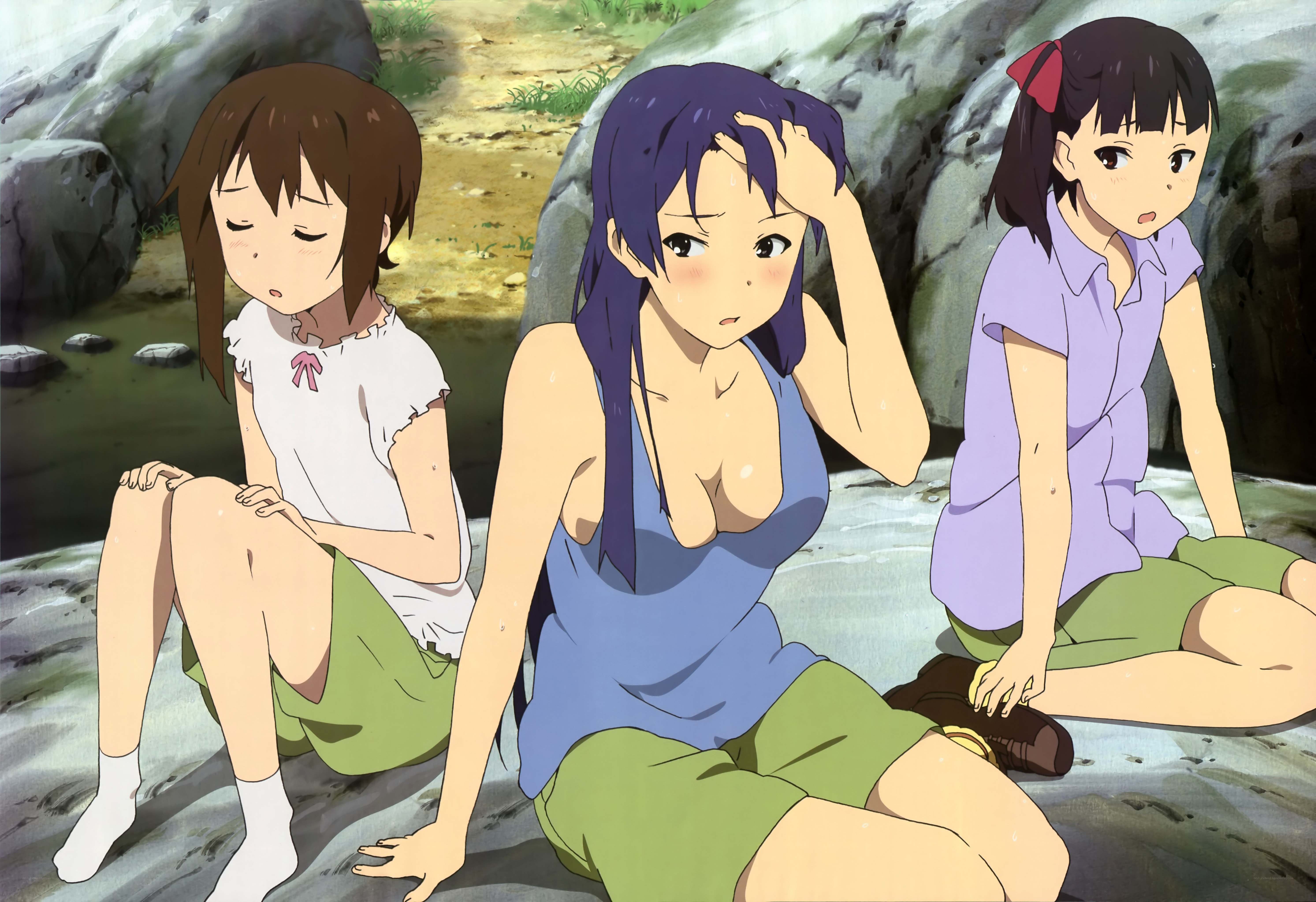 Three girls resting by a stream