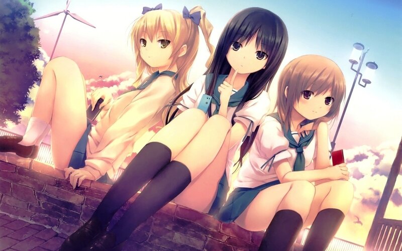 Three Girls Sitting on Wall