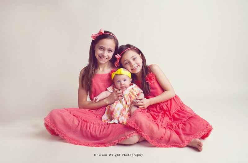 Three Girls Sitting Together