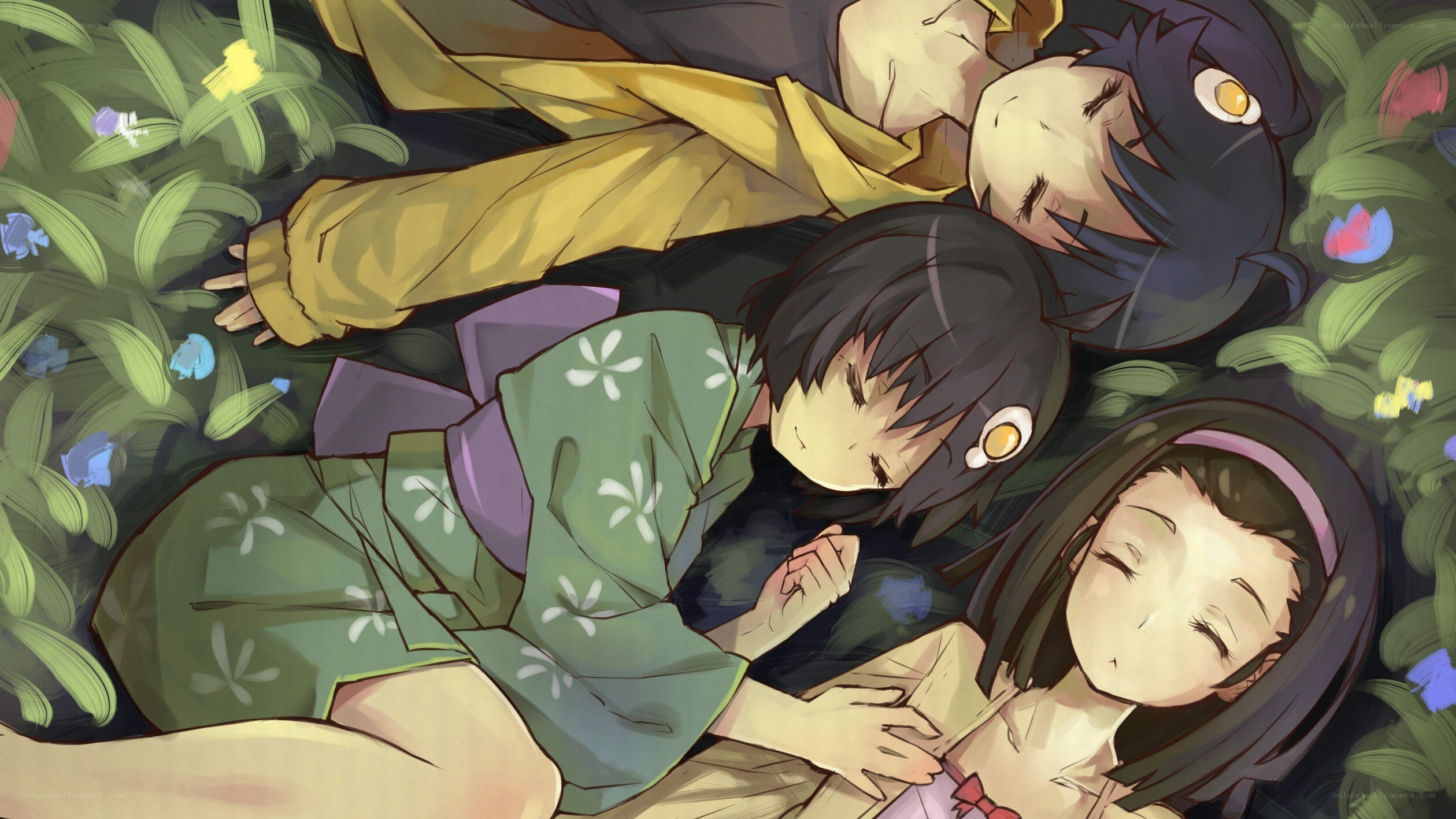 three girls sleeping in grass