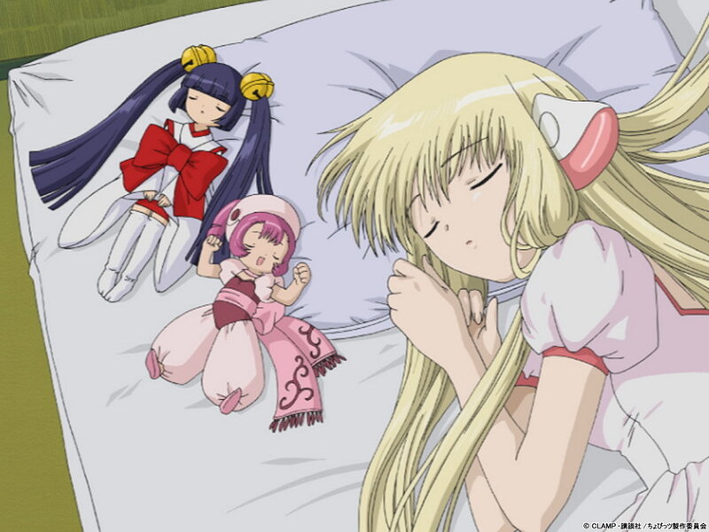 Three girls sleeping on a bed