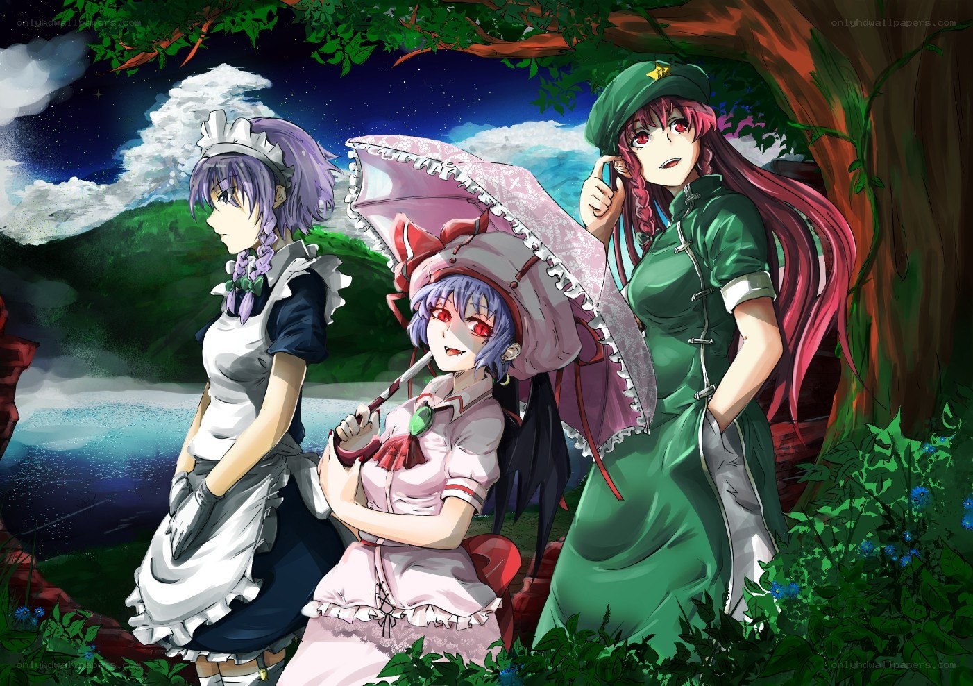 Three girls under a tree at night