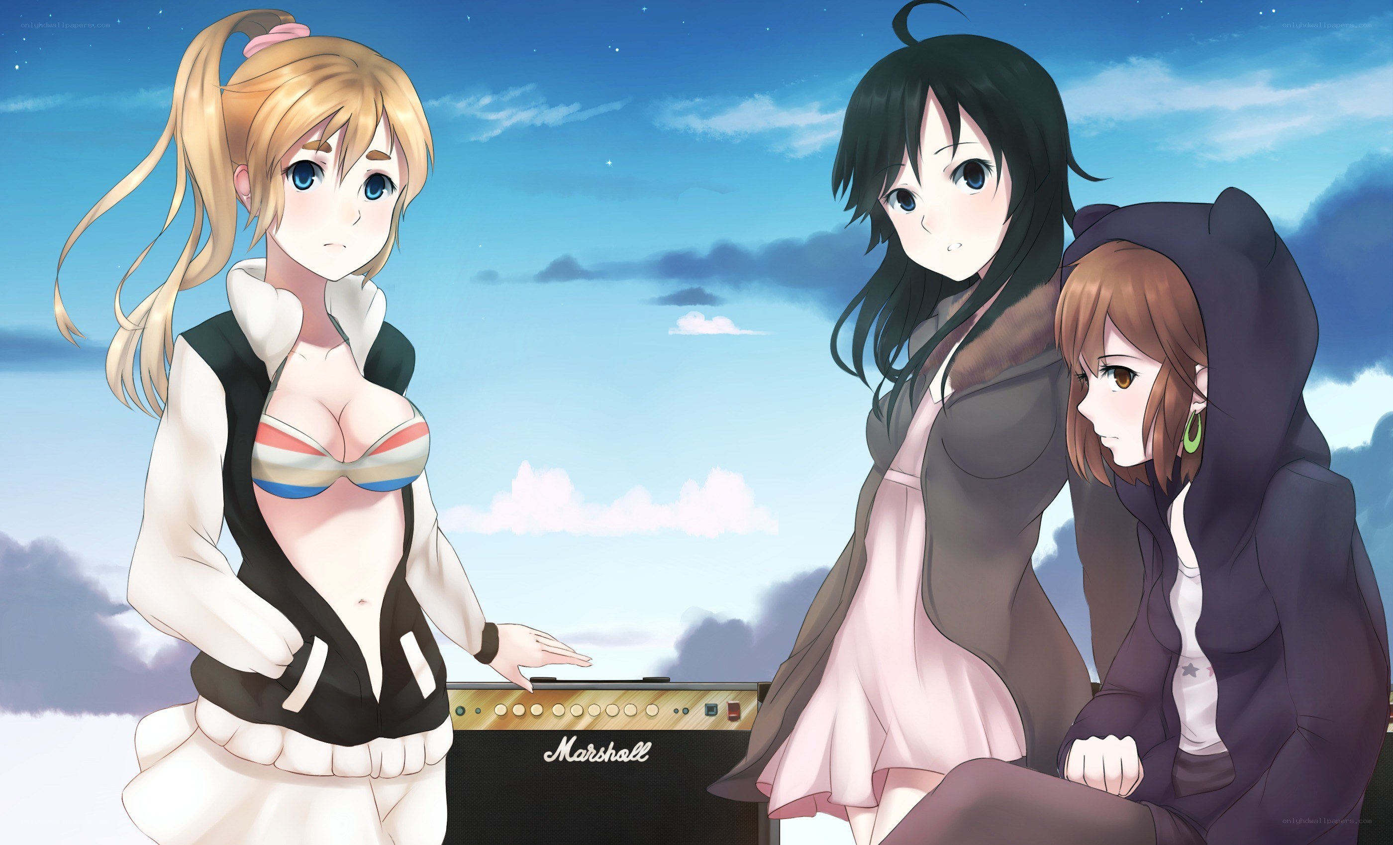 Three girls with a guitar amp