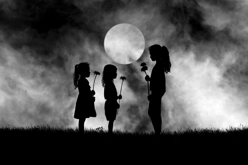 Three Girls with Dandelions
