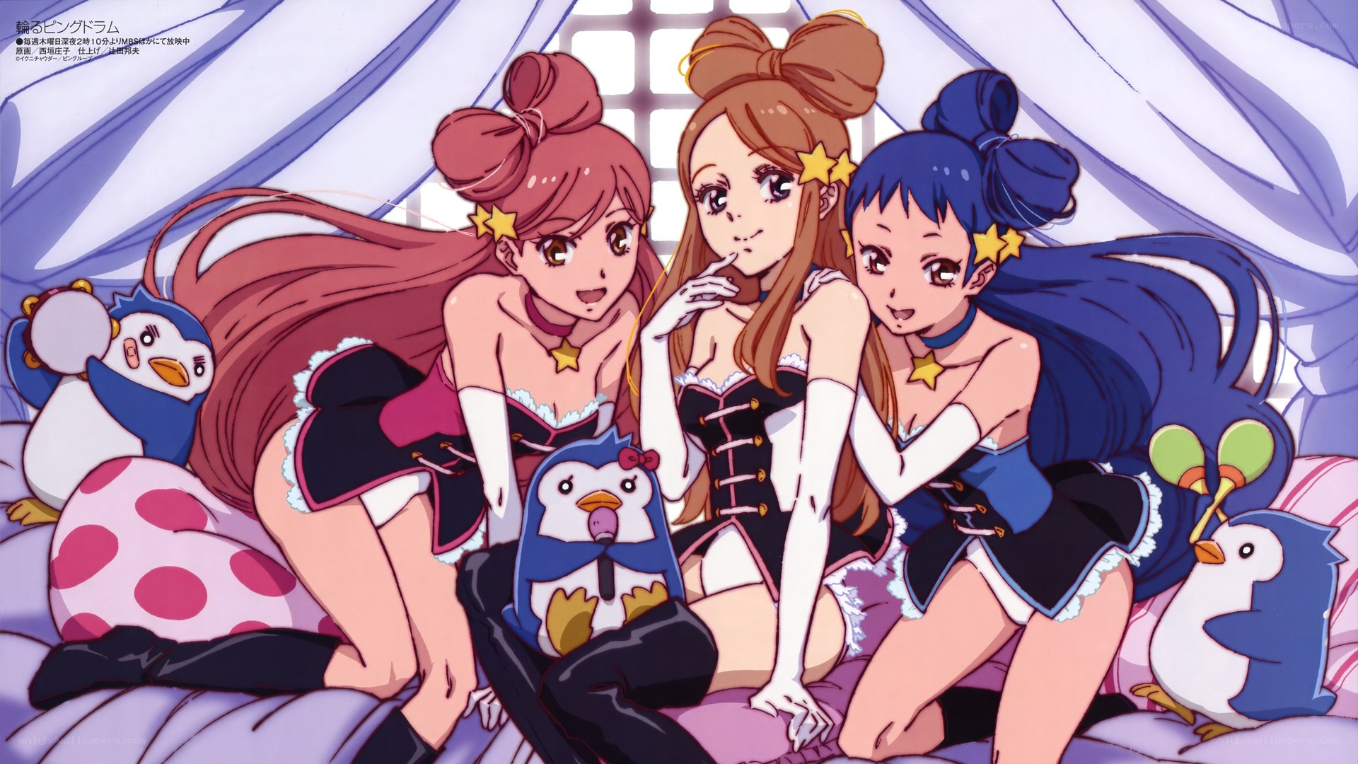 Three girls with penguins