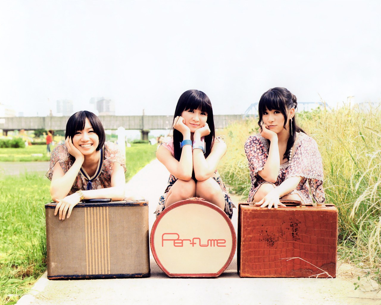 Three girls with suitcases