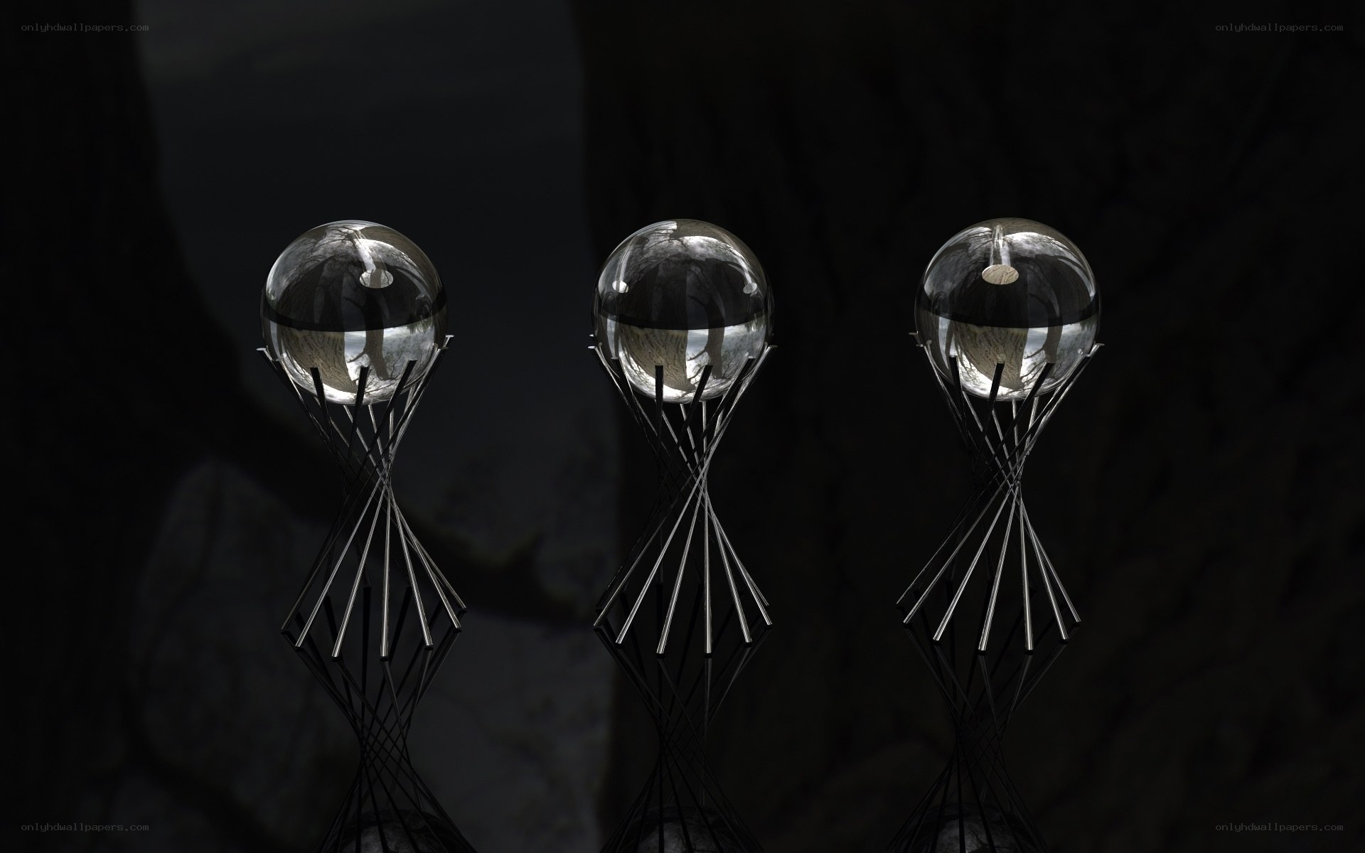 Three glass orbs on metal stands