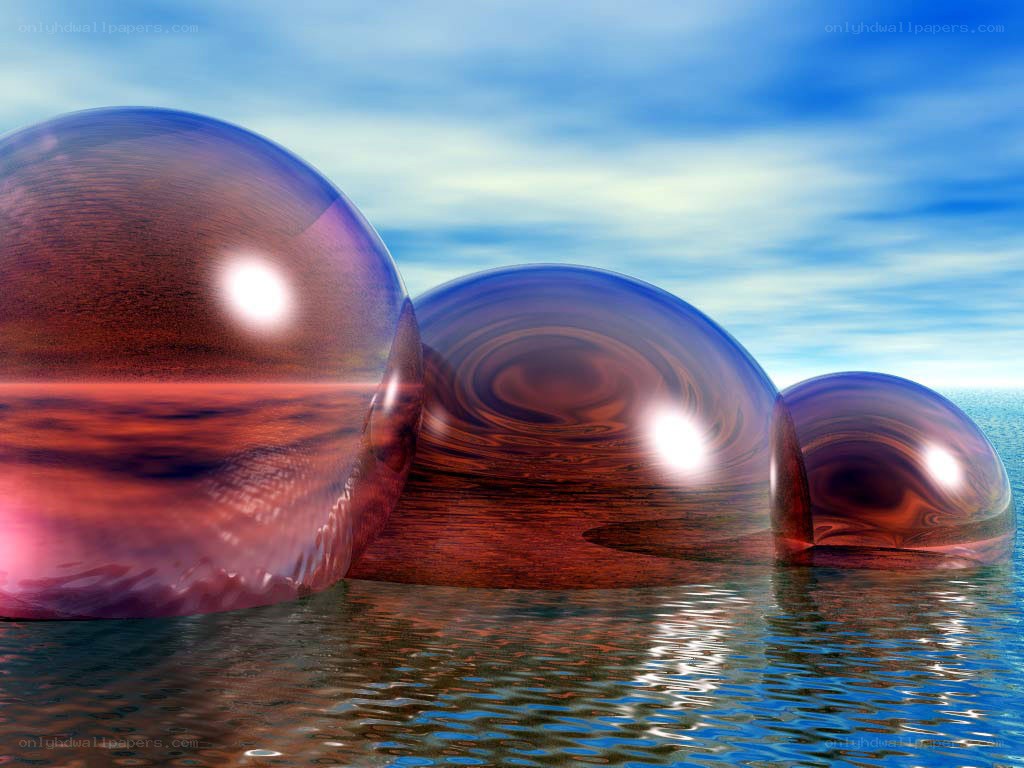 Three glass spheres on water