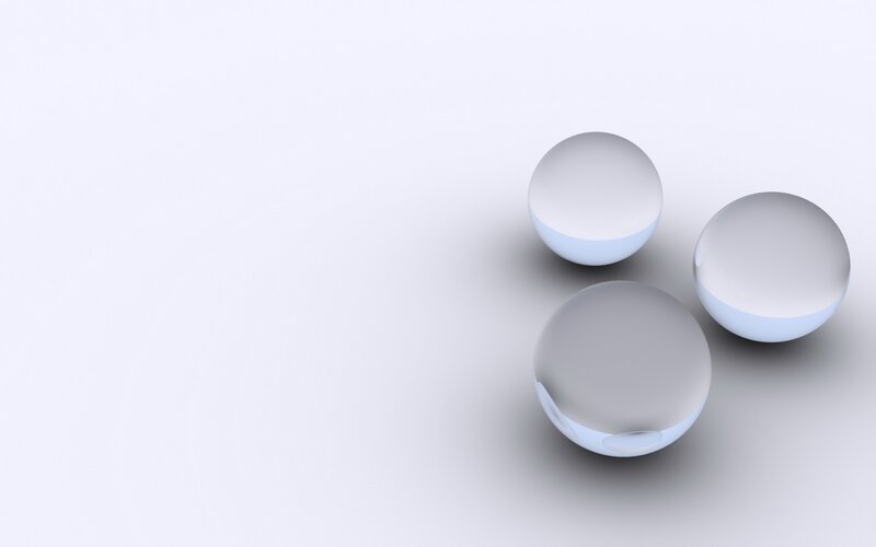 three glass spheres on white
