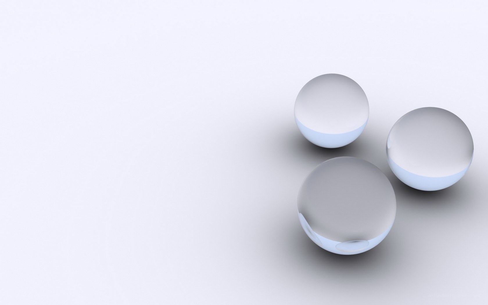 three glass spheres on white