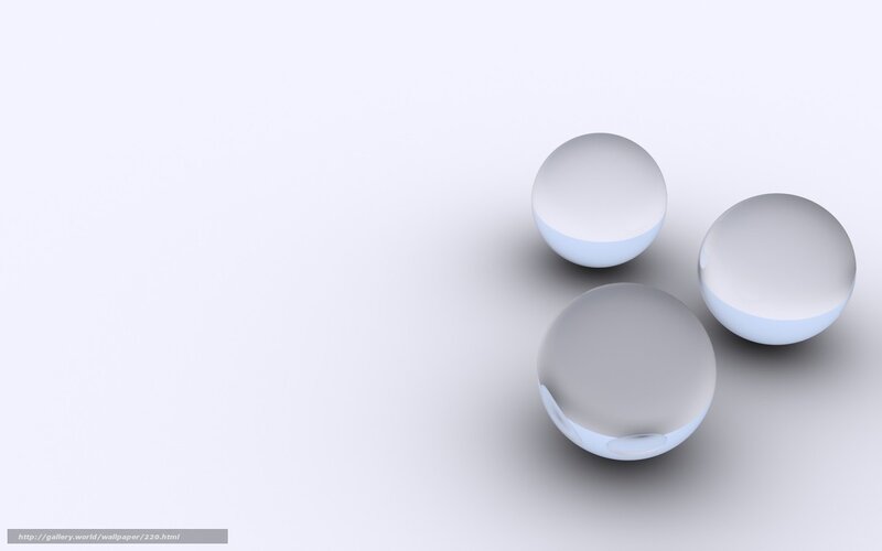 Three glass spheres on white