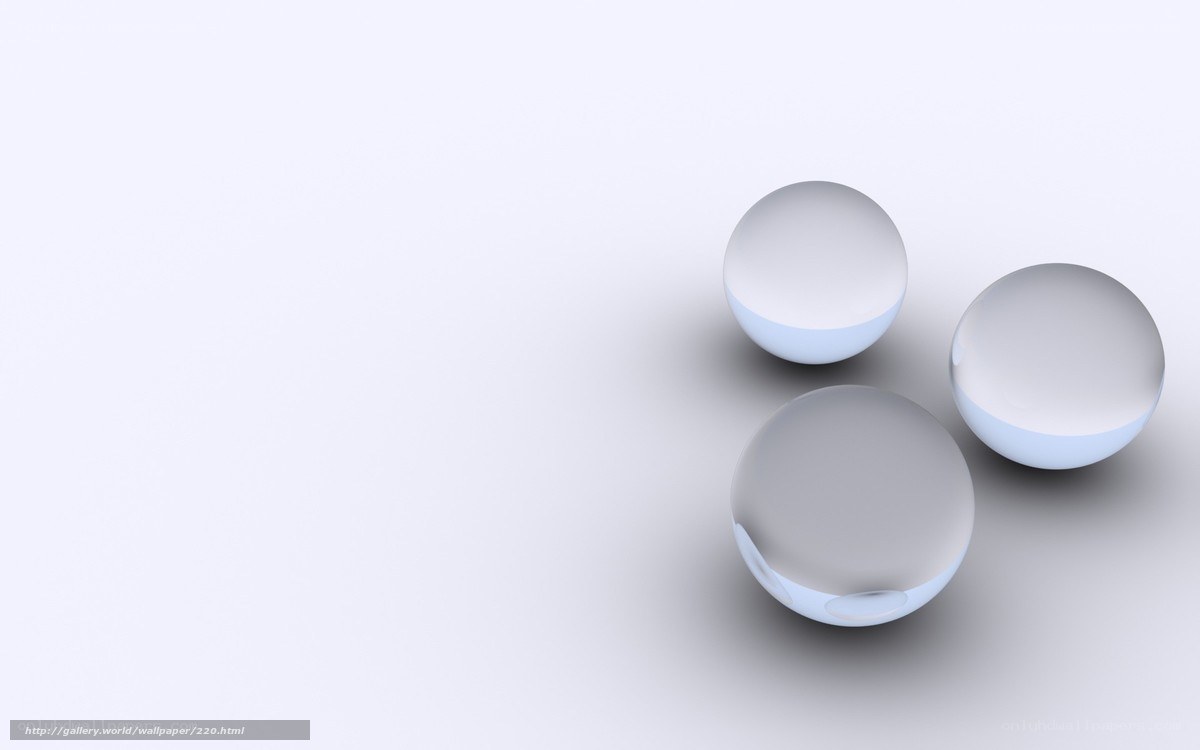 Three glass spheres on white