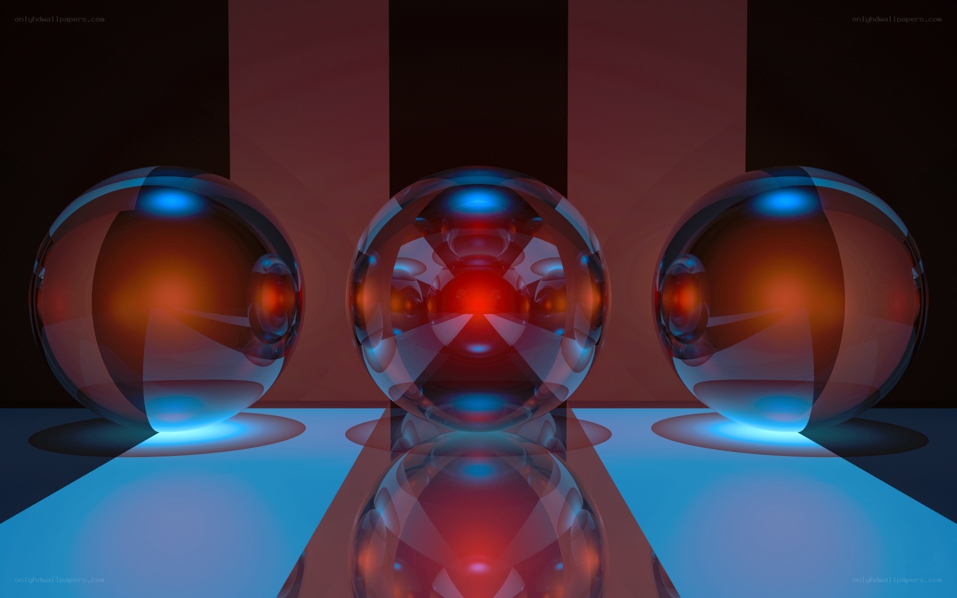 Three glass spheres with light reflections