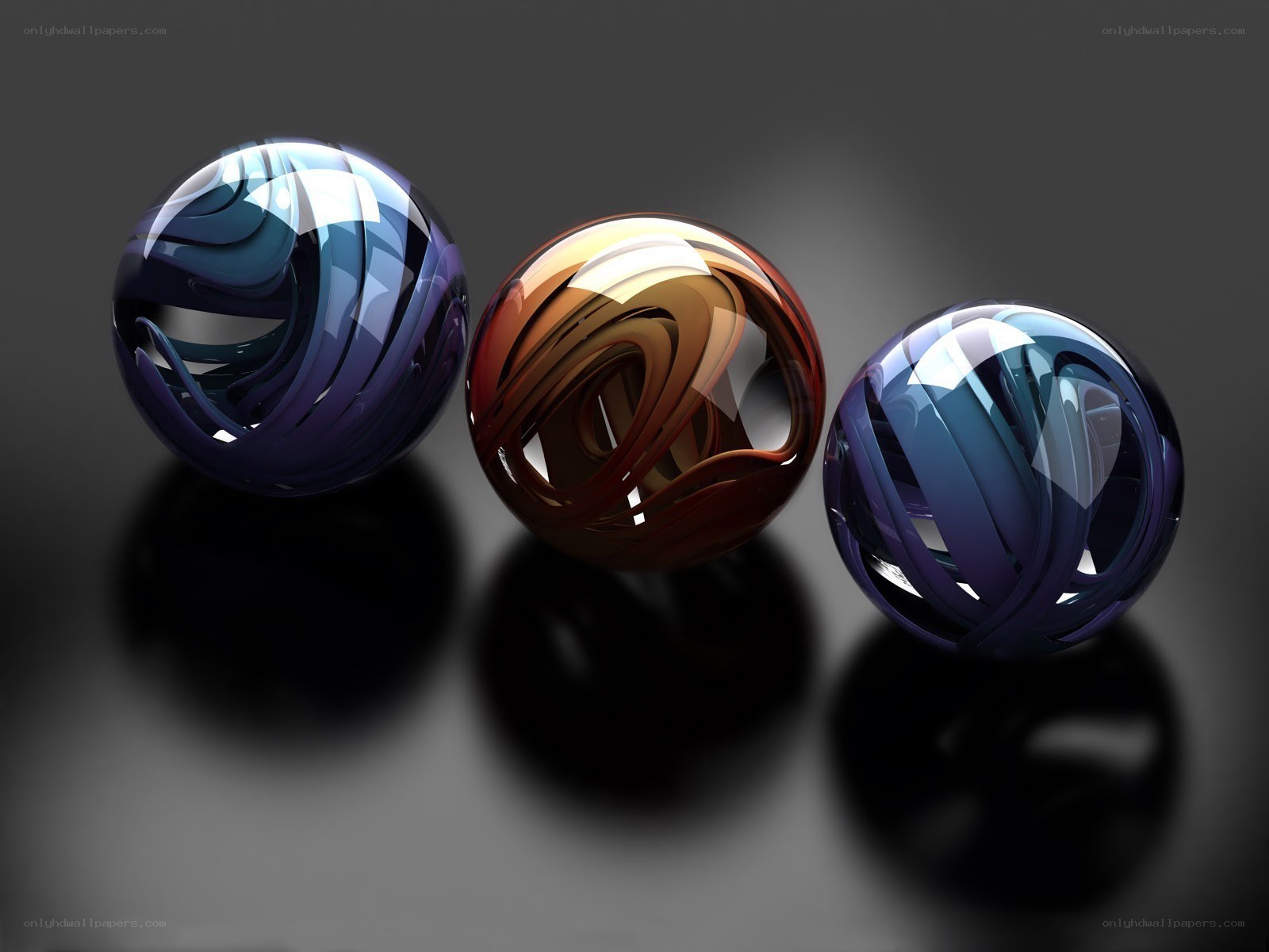 Three glass spheres with swirls