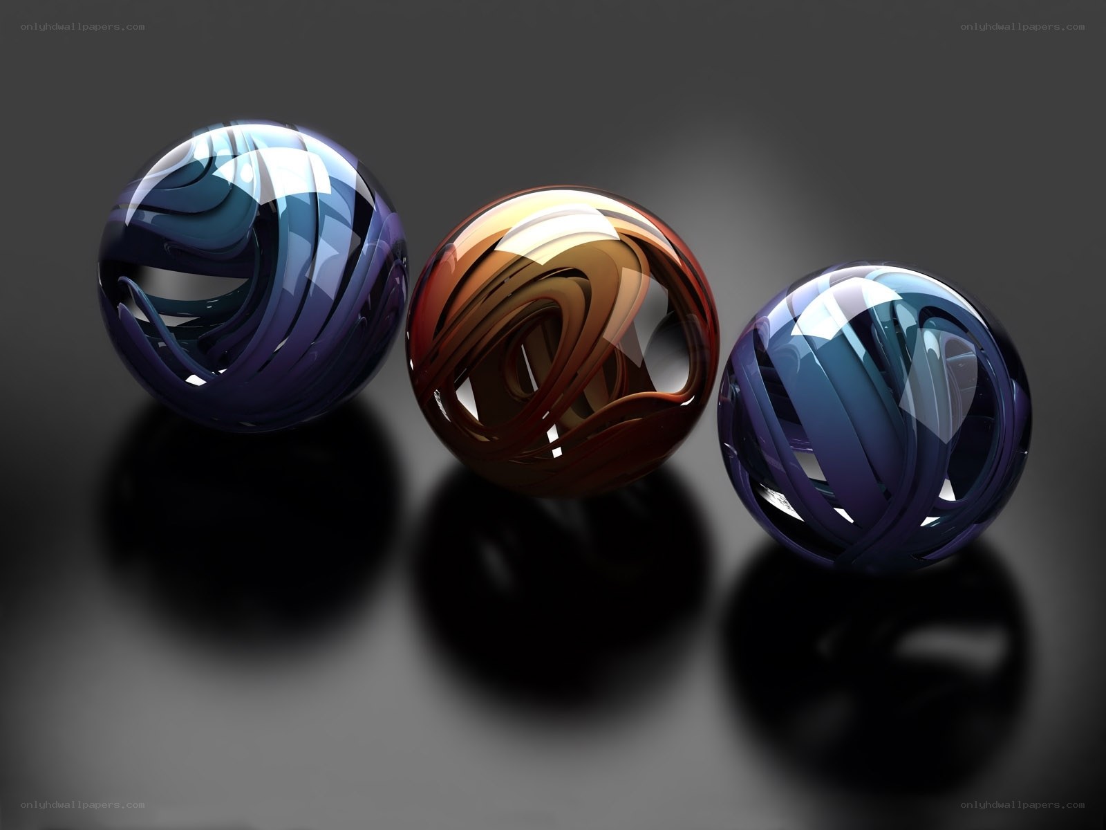 Three glass spheres with swirls