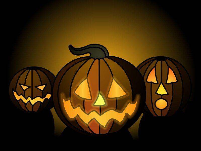Three glowing jack-o'-lanterns