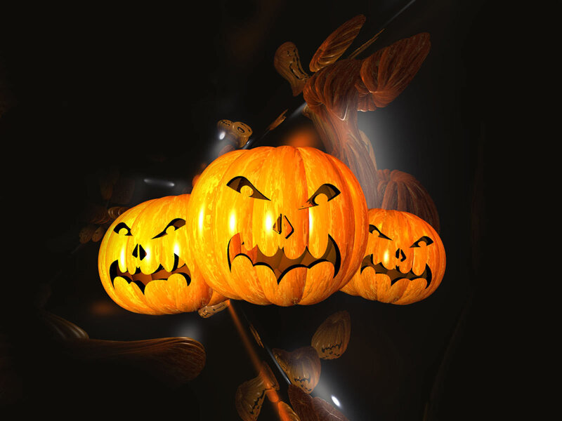 Three glowing jack-o'-lanterns