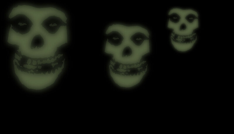 Three Glowing Skulls