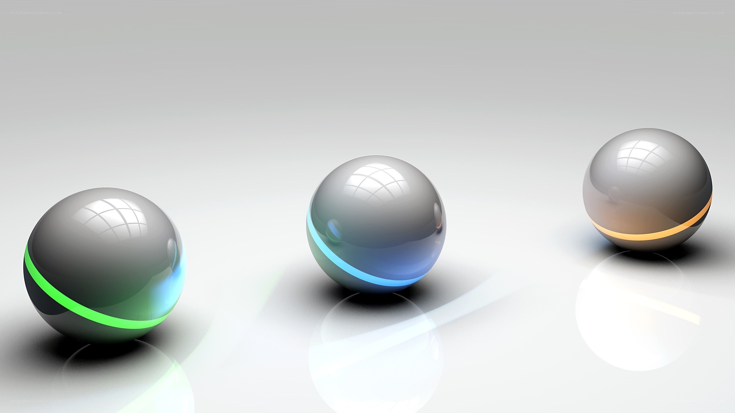 Three glowing spheres on white