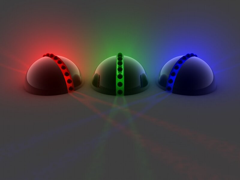 Three glowing spheres with colored lights